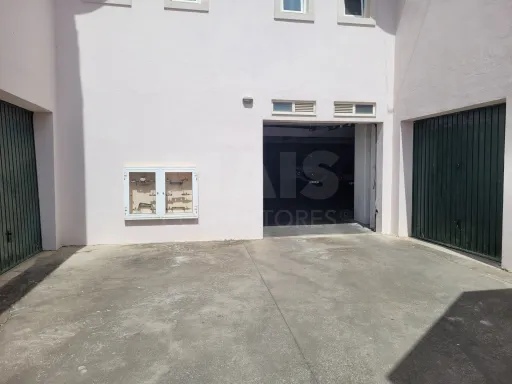 Covered parking space and storage room